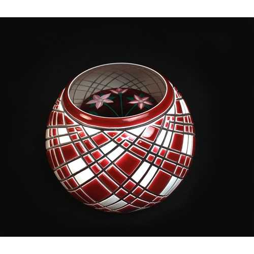 43 - A John Deacons paperweight, with red and white overlaid exterior emcompassing red and white flowers ... 