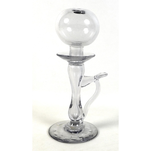 46 - A 19th century clear glass lace maker's oil lamp, with spherical holed top above a drip pan, above a... 