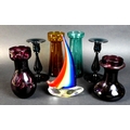 A group of seven 19th century and later colourful glass wares, comprising four 19th century bulb vas... 
