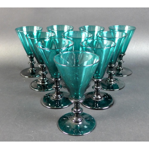 50 - A set of ten Regency Bristol green wine glasses, with conical bowls and knopped stems, rough pontil ... 