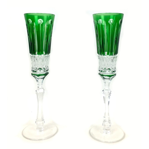 51 - A pair of 20th century Faberge Xenia emerald green glass champagne flutes, both with Faberge marks t... 