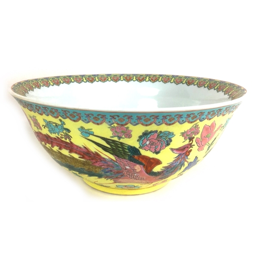 6 - A large Chinese 20th century bowl, decorated with a floral rim to its interior and a phoenix and flo... 