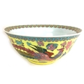 A large Chinese 20th century bowl, decorated with a floral rim to its interior and a phoenix and flo... 