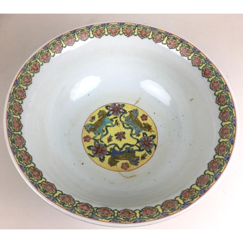 6 - A large Chinese 20th century bowl, decorated with a floral rim to its interior and a phoenix and flo... 