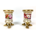 A pair of early 19th century Coalport style porcelain spill vases, each with cylindrical form with f... 