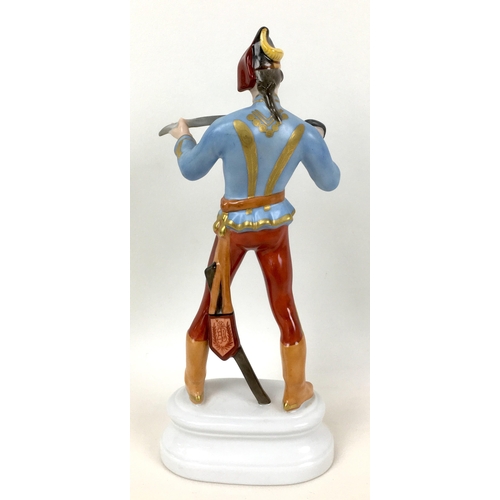 68 - A Herend figurine of a Hungarian dragoon, numbered 5526 and signed 'S' to its base, 10 by 6 by 23cm ... 
