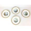 A set of four late Victorian Mintons plates, decorated with hand painted scenes from nature, surroun... 