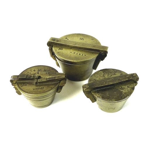 89 - A group of three Continental brass nested cup weights, made in Nuremberg comprising seven weight set... 