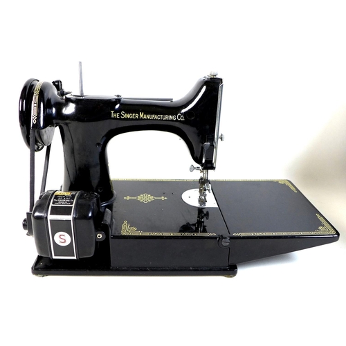 96 - A vintage Singer Featherweight 221K portable sewing machine, serial number EH244952, with fold out p... 