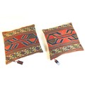 A pair of cushions covered in kilim once belonging to Rudolf Nureyev, each 45 by 43cm, with original... 
