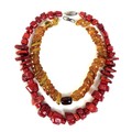 An irregular beaded amber necklace, 41cm long, 64g, together with a red coral necklace, 55cm long (2... 