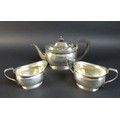 A George V silver bachelor's tea set, Atkin Brothers, London 1922, comprising a teapot with ebony fi... 