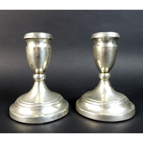 68 - A pair of ER II silver dwarf candlesticks, with weighted bases, Roberts & Dore, Birmingham, 1980, 8.... 