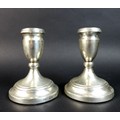 A pair of ER II silver dwarf candlesticks, with weighted bases, Roberts & Dore, Birmingham, 1980, 8.... 