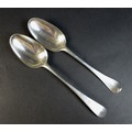Two Georgian silver table spoons, comprising a George II silver table spoon, Old English pattern, te... 