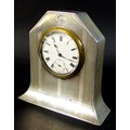 A George V Art Deco silver cased clock, with subsidiary seconds dial, engraved with the initial 'M',... 