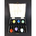 A cased set of six enamel coffee spoons, with coffee bean finials, each 9.3cm long, William Suckling... 