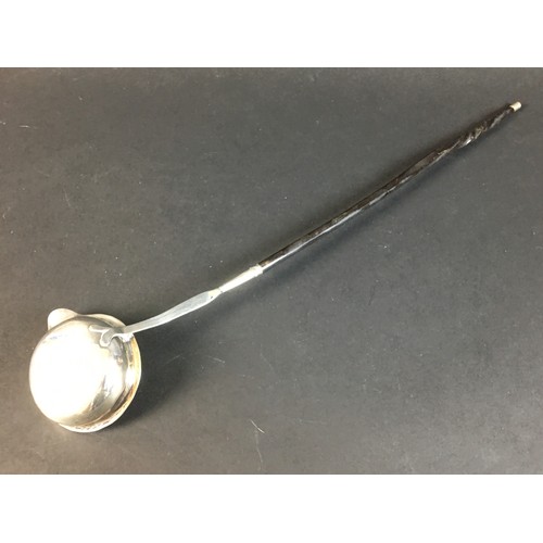 57 - A William IV silver toddy ladle and two others, all with twisted whale bone handles, comprising a Wi... 