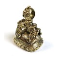 A Victorian gold plated fob seal, the rococo scroll mount set with an intaglio carved smoked quartz,... 