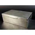 An Art Deco silver cigarette box, with engine turned decoration and Greek Key pattern to the corners... 
