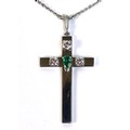 An 18ct white gold cross set with three diamonds and a central pear cut emerald, complete with an 18... 