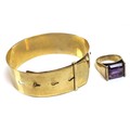 A 9ct gold buckle bangle bracelet, 14.8g, together with a modernist design 9ct gold and emerald cut ... 