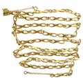 An 18ct gold fancy link necklace, with ring clasp and safety chain attached, 84cm, 34.0g.