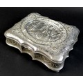 A 19th century Continental white metal jewellery box, with shaped outline, the hinged cover cast in ... 