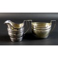 Two pieces of George III silver, comprising a twin handled sugar bowl of oval form, with reeded hand... 