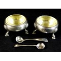 A pair of early George III silver cauldron salts, with parcel gilt interiors, both with engraved mon... 