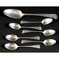 Seven pieces of George III Hanoverian pattern  silver flatware, comprising a table spoon, 22cm long,... 