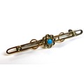 A 9ct gold turquoise and seed pearl bar brooch, with central flowerhead design, adjoined by two gold... 