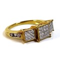 An 18ct gold and diamond multi-stone ring, with thirty four brilliant cut diamonds spread across thr... 