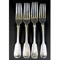Four silver fiddle pattern table forks, comprising a pair of Victorian forks with the initial 'A' en... 
