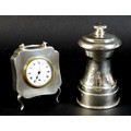 A George V silver cased travel clock of quatrefoil form, with machine turned decoration, rubbed make... 