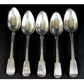 Five Georgian silver fiddle pattern table spoons, comprising a pair of George III spoons, each with ... 