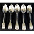 Five George IV and Victorian silver fiddle pattern dessert spoons, comprising three George IV spoons... 