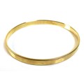 A 14K yellow gold bangle, of plain form, marked '585', 6.3cm internal and 6.7cm external diameter, 2... 