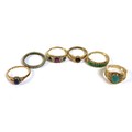A group of six gold and unmarked metal rings, comprising a Victorian / Edwardian seven stone ring, s... 
