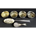 A group of Victorian and later decorative silver comprising four bonbon dishes, of swirl gadrooned d... 