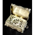 A Victorian silver vinaigrette, of shaped rectangular form, with wave engine turned decoration to th... 