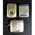 A group of three vesta cases, comprising a Victorian silver example of curved rectangular form, John... 