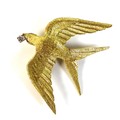 An 18ct yellow gold brooch in the form of a bird, swift or swallow, modelled with outstretched wings... 