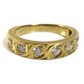 An 18ct gold and diamond half eternity ring, of modern rub-over design set with eight similarly size... 
