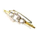 A Victorian 12ct gold three 'stone' brooch, the central square cushion cut clear glass / crystal, 17... 