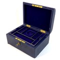 A late Victorian dark blue leather jewellery case, with gilt brass recessed handle with engraved dec... 