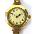 An Art Deco Baume & Company 18ct gold lady's wire lug wristwatch, circular cream dial with black Rom... 