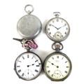 A group of three pocket watches and a WWII pocket compass, comprising a 1940s silver cased open face... 