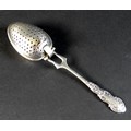 An Edward VII silver tea infuser, fancy scroll decorated handle with two pronged support to the two ... 