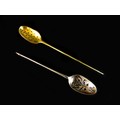 Two 18th century silver mote spoons, one with scroll piercings and engraved crest to oval bowl, tape... 